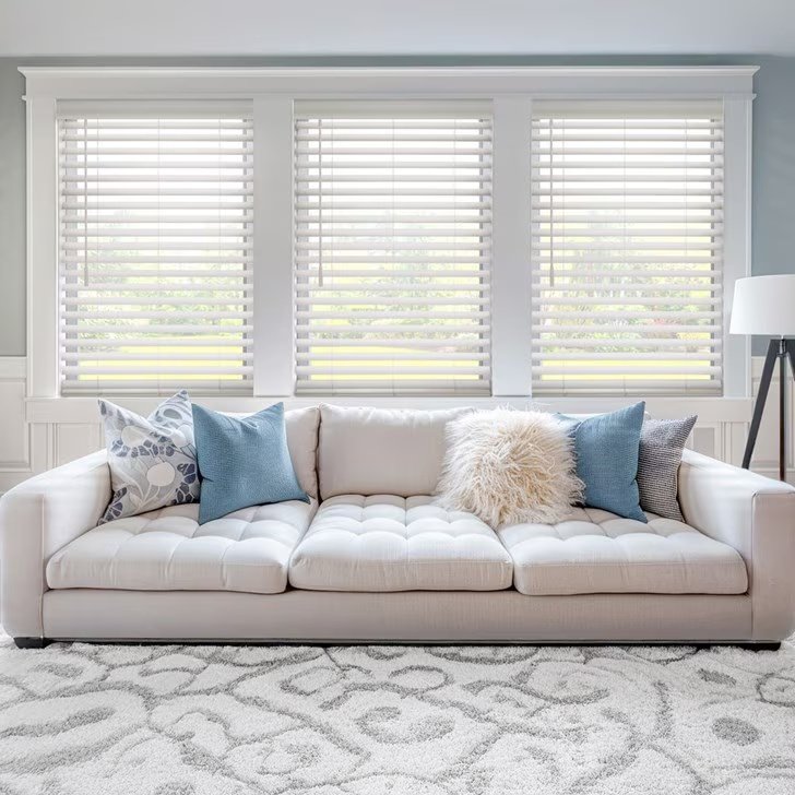 Brown wood blinds installed in a bright living room